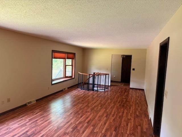 20430 Rhoda Ave, Ravenna Twp, MN 55089 - spare room featuring wood finished floors and a textured ceiling