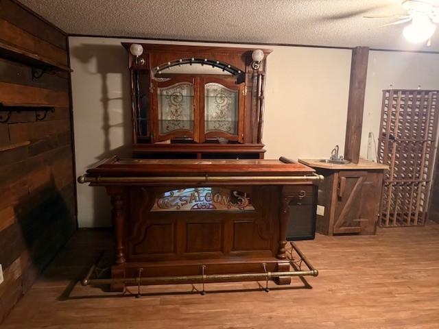20430 Rhoda Ave, Ravenna Twp, MN 55089 - detailed view of wood finished floors, a textured ceiling, and a ceiling fan