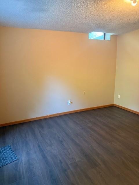 20430 Rhoda Ave, Ravenna Twp, MN 55089 - empty room with dark wood-style floors and a textured ceiling