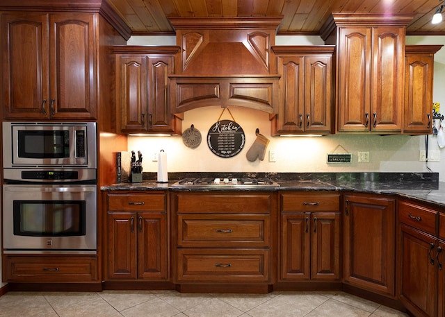 9777 Gruhlke Rd, Summit Twp, WI 54836 - kitchen with stainless steel appliances, crown molding, wood ceiling, dark stone counters, and light tile patterned floors