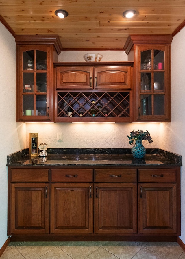9777 Gruhlke Rd, Summit Twp, WI 54836 - indoor dry bar with crown molding, wooden ceiling, and light tile patterned floors