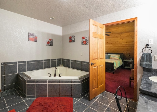 9777 Gruhlke Rd, Summit Twp, WI 54836 - full bathroom with tile patterned flooring, a bath, a textured ceiling, a textured wall, and vanity