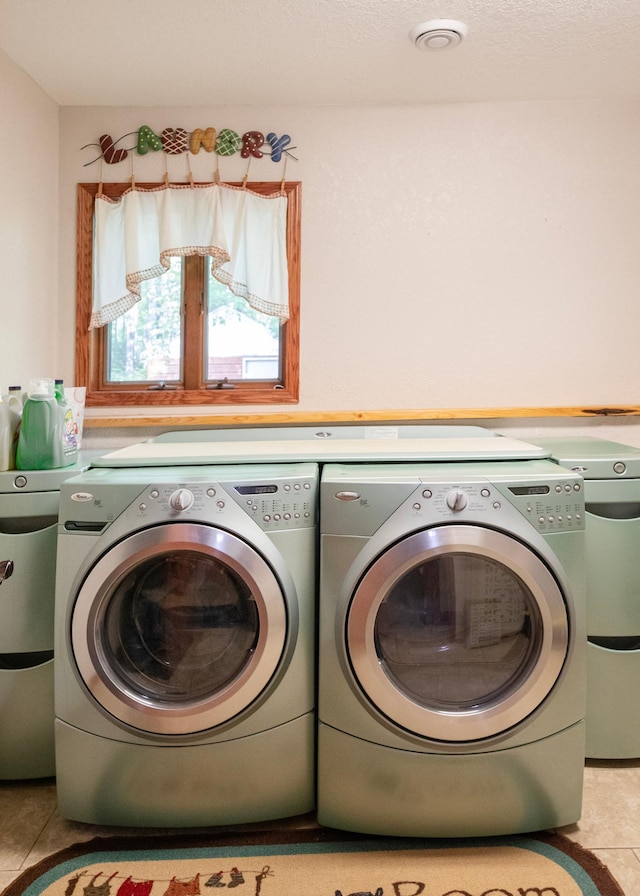 9777 Gruhlke Rd, Summit Twp, WI 54836 - laundry area featuring separate washer and dryer and tile patterned floors