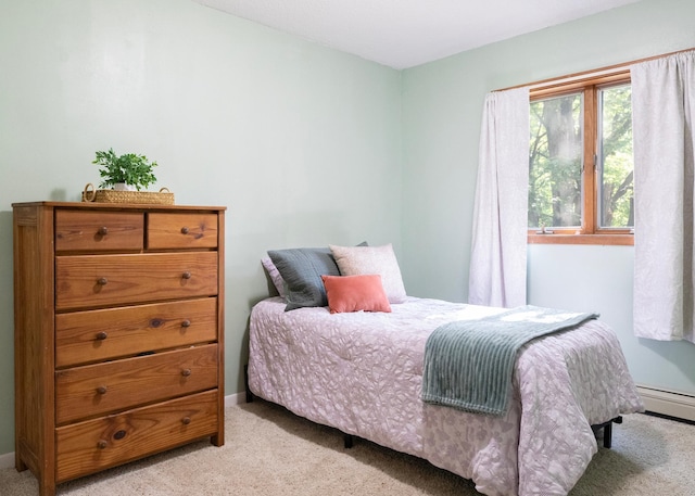 9777 Gruhlke Rd, Summit Twp, WI 54836 - bedroom with light colored carpet and a baseboard heating unit