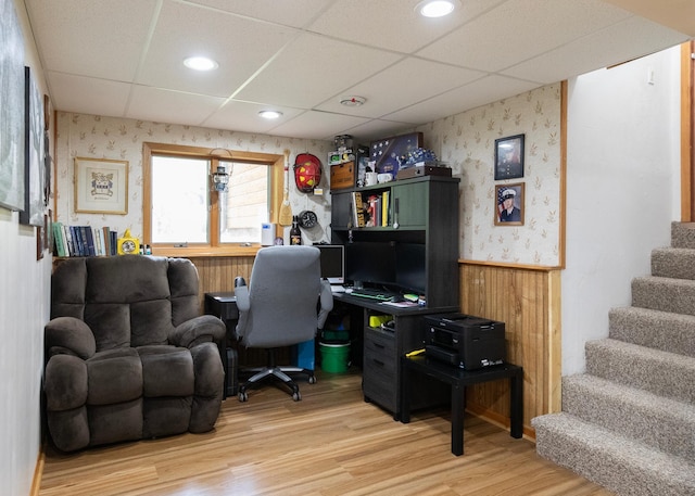 9777 Gruhlke Rd, Summit Twp, WI 54836 - office area featuring wallpapered walls, wainscoting, wood finished floors, a paneled ceiling, and wooden walls