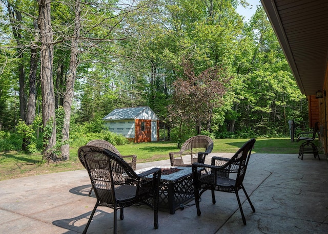 9777 Gruhlke Rd, Summit Twp, WI 54836 - view of patio featuring an outdoor structure and an outdoor fire pit