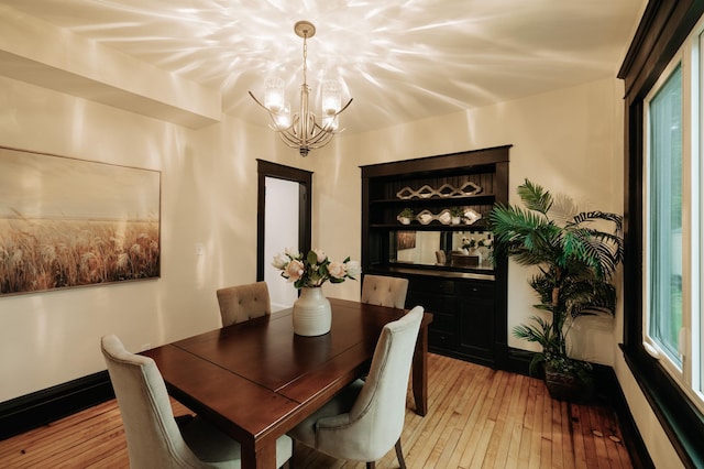 3445 4th Ave S, Minneapolis, MN 55408 - dining space with a chandelier and light wood-style floors