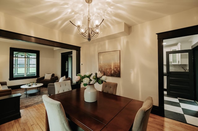 3445 4th Ave S, Minneapolis, MN 55408 - dining space featuring a chandelier and light wood-style flooring