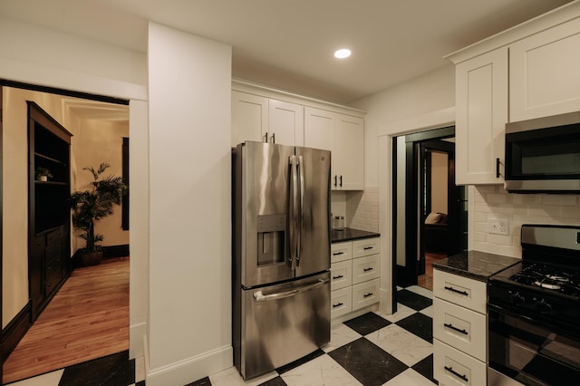 3445 4th Ave S, Minneapolis, MN 55408 - kitchen featuring appliances with stainless steel finishes, white cabinets, tasteful backsplash, recessed lighting, and dark countertops