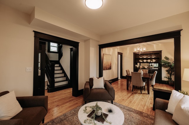 3445 4th Ave S, Minneapolis, MN 55408 - living area featuring a chandelier, hardwood / wood-style flooring, and stairs