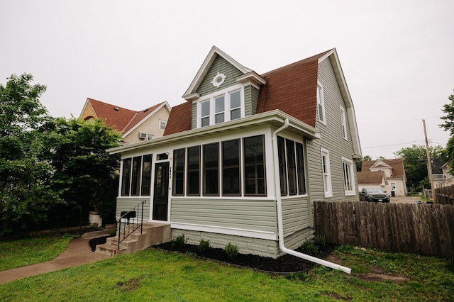 3445 4th Ave S, Minneapolis, MN 55408 - rear view of house featuring a sunroom