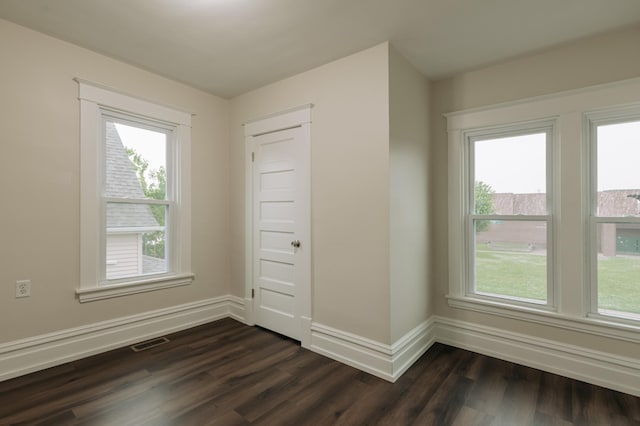 3445 4th Ave S, Minneapolis, MN 55408 - empty room featuring dark wood-type flooring and baseboards