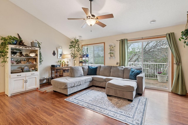 8547 Grove Cir, Shakopee, MN 55379 - living area featuring ceiling fan, wood finished floors, and vaulted ceiling