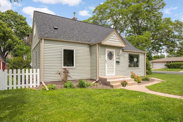 333 3rd St NE, Osseo, MN 55369 - view of front of home with roof with shingles and a chimney