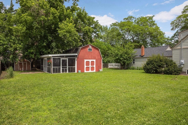 333 3rd St NE, Osseo, MN 55369 - view of yard with a shed and a sunroom