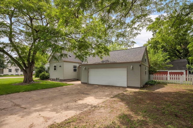 333 3rd St NE, Osseo, MN 55369 - view of front of home featuring a garage and a shingled roof