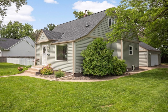 333 3rd St NE, Osseo, MN 55369 - view of property exterior featuring a shingled roof and an outbuilding