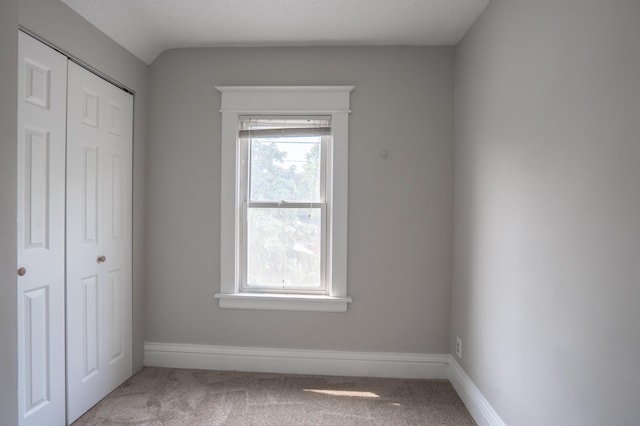 938 Cypress St, Saint Paul, MN 55106 - unfurnished bedroom with carpet floors, multiple windows, and a closet