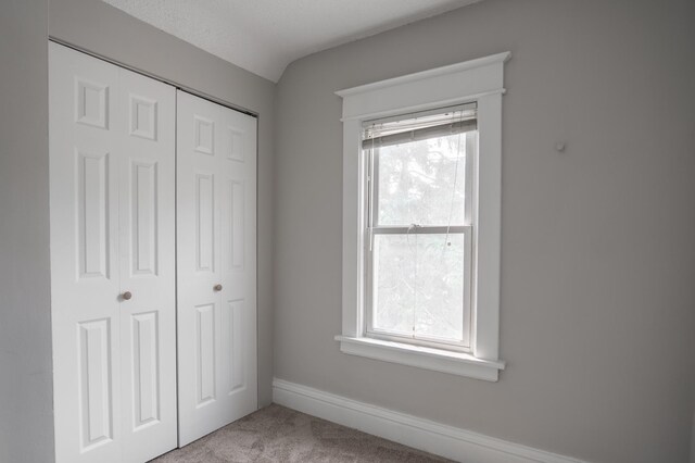 938 Cypress St, Saint Paul, MN 55106 - unfurnished bedroom featuring light carpet and a closet