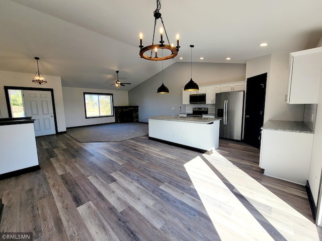 217 Bouldercrest Ave NE, Owatonna, MN 55060 - kitchen featuring appliances with stainless steel finishes, white cabinetry, a chandelier, ceiling fan, and open floor plan