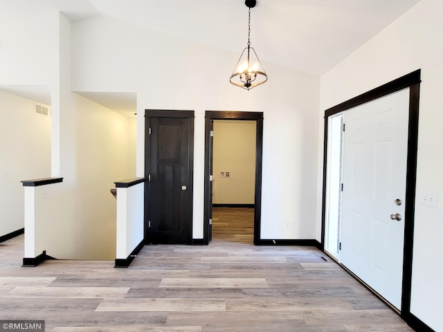 217 Bouldercrest Ave NE, Owatonna, MN 55060 - entrance foyer with lofted ceiling and light wood finished floors