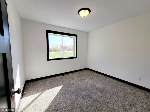 217 Bouldercrest Ave NE, Owatonna, MN 55060 - carpeted empty room with baseboards