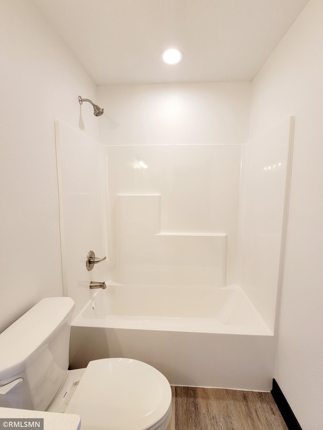 217 Bouldercrest Ave NE, Owatonna, MN 55060 - bathroom with wood finished floors and shower / tub combination
