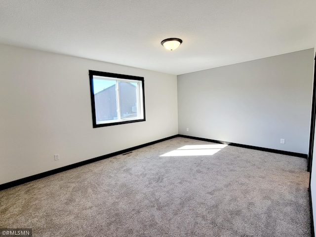 217 Bouldercrest Ave NE, Owatonna, MN 55060 - spare room with carpet floors