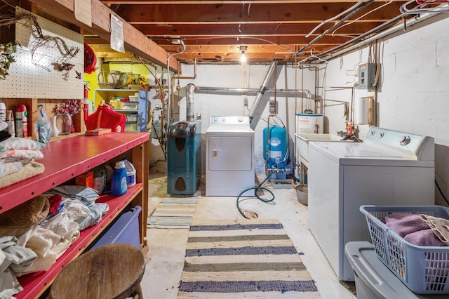 unfinished basement featuring independent washer and dryer and a water pressure tank
