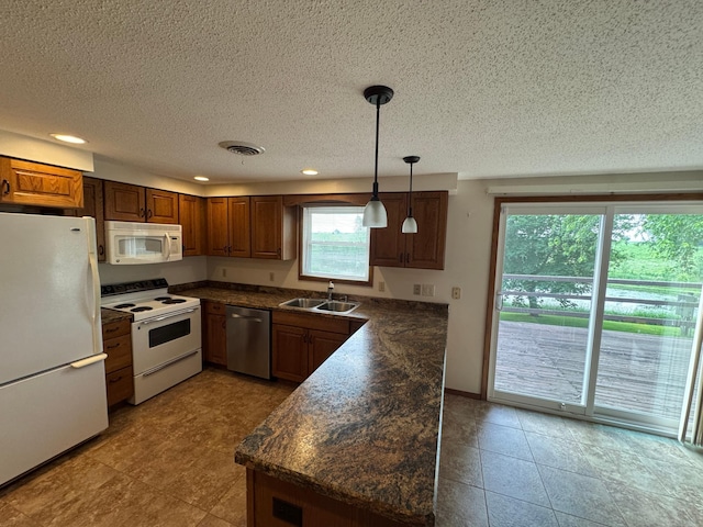 1572 County Road 4, Island Lake Twp, MN 56157 - kitchen featuring white appliances, dark countertops, recessed lighting, brown cabinetry, and a textured ceiling