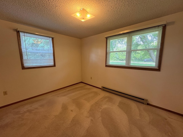 1572 County Road 4, Island Lake Twp, MN 56157 - carpeted spare room with a baseboard heating unit and a textured ceiling