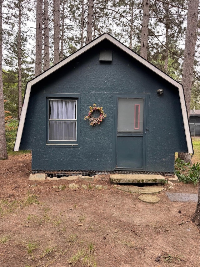 36434 145th Ave, Blueberry Twp, MN 56464 - view of side of property featuring stucco siding and a gambrel roof