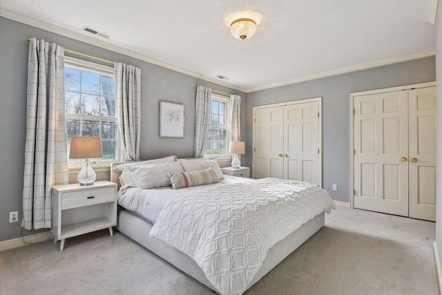 4022 Hillcrest Rd, Deephaven, MN 55391 - carpeted bedroom with ornamental molding and multiple closets