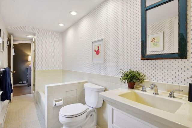 4022 Hillcrest Rd, Deephaven, MN 55391 - full bath with wallpapered walls, vanity, a tub to relax in, recessed lighting, and tile patterned floors