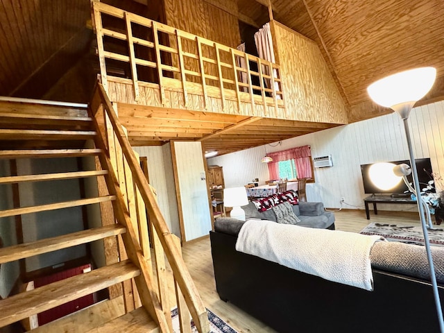 42863 270th St, Malung Twp, MN 56751 - living area featuring high vaulted ceiling, stairs, wood ceiling, wooden walls, and wood finished floors