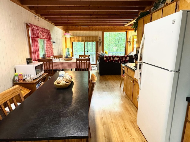42863 270th St, Malung Twp, MN 56751 - dining area with light wood finished floors and wooden walls