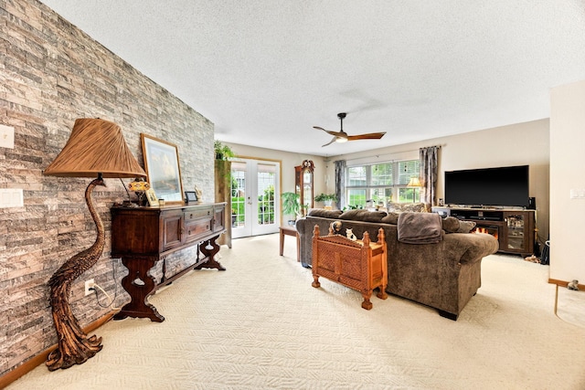 119 Morningside Dr NE, Hutchinson, MN 55350 - living area featuring carpet flooring, a textured ceiling, french doors, and a ceiling fan