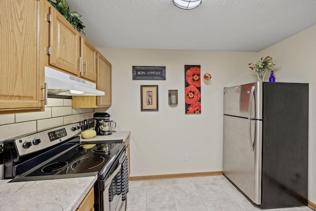119 Morningside Dr NE, Hutchinson, MN 55350 - kitchen featuring appliances with stainless steel finishes, under cabinet range hood, light countertops, decorative backsplash, and a textured ceiling