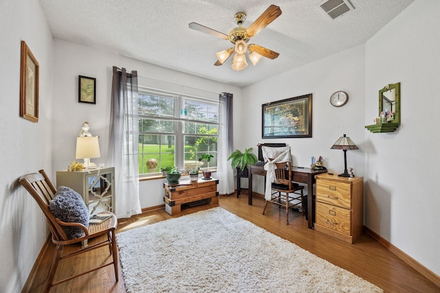 119 Morningside Dr NE, Hutchinson, MN 55350 - office space with ceiling fan, a textured ceiling, and wood finished floors