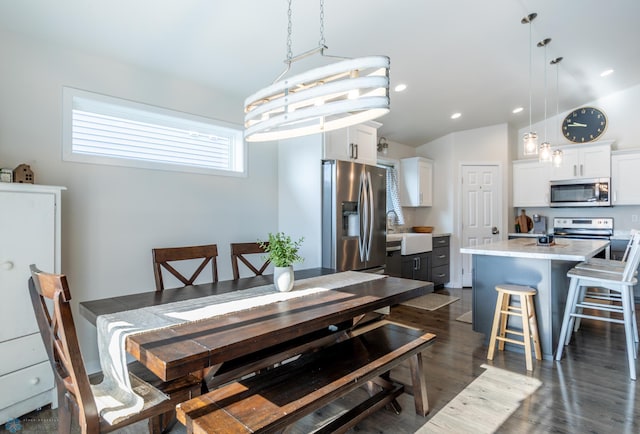 7339 21st St S, Fargo, ND 58104 - dining space featuring lofted ceiling, dark wood-style floors, and recessed lighting