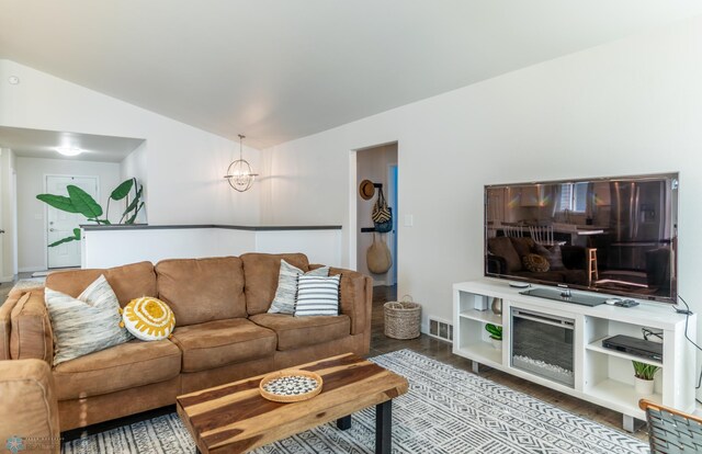 7339 21st St S, Fargo, ND 58104 - living room featuring vaulted ceiling and wood finished floors