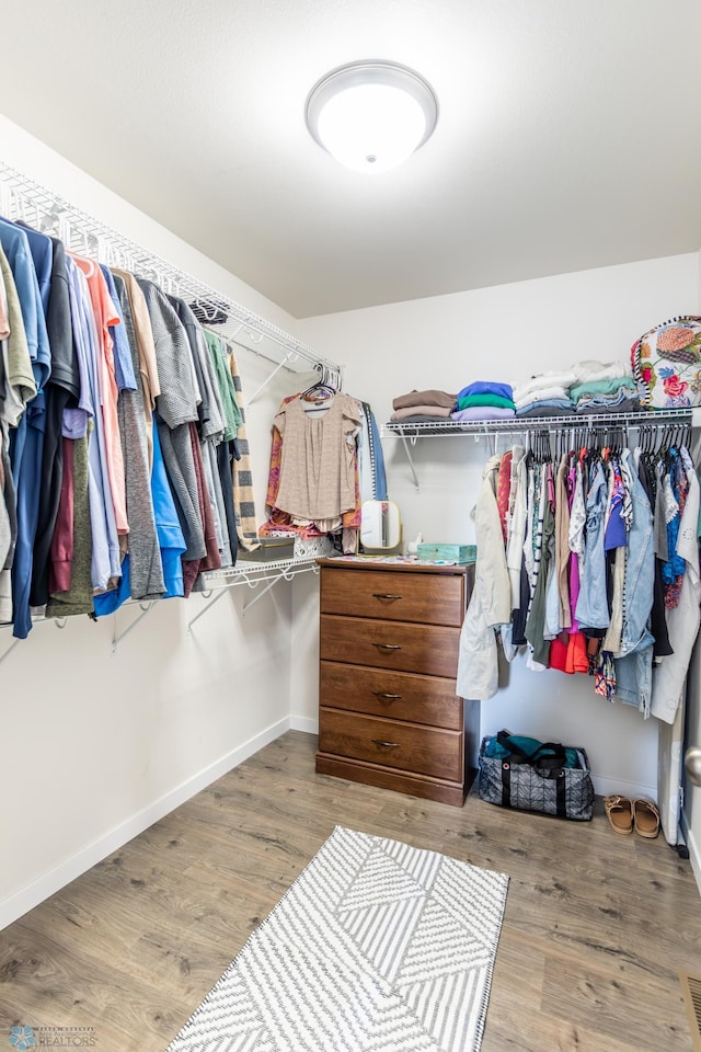 7339 21st St S, Fargo, ND 58104 - walk in closet with wood finished floors