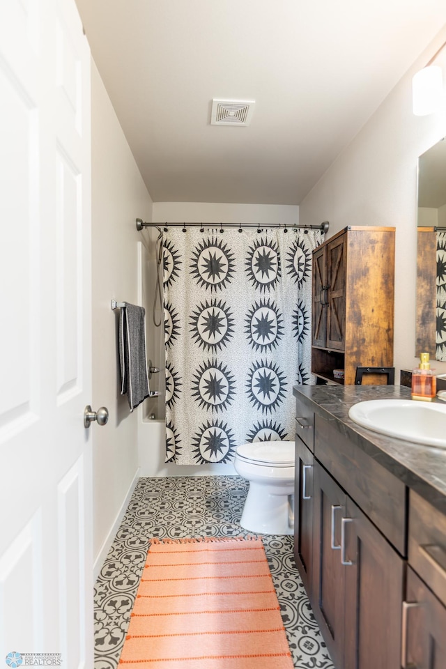 7339 21st St S, Fargo, ND 58104 - bathroom with vanity, tile patterned floors, and shower / tub combo with curtain
