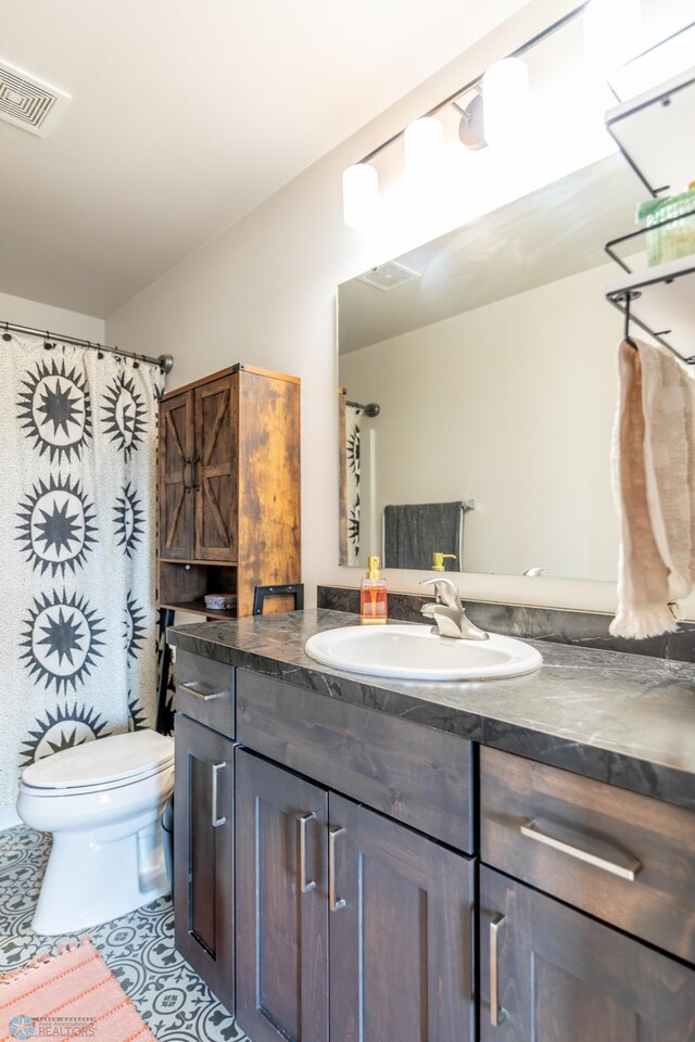 7339 21st St S, Fargo, ND 58104 - bathroom featuring vanity and toilet