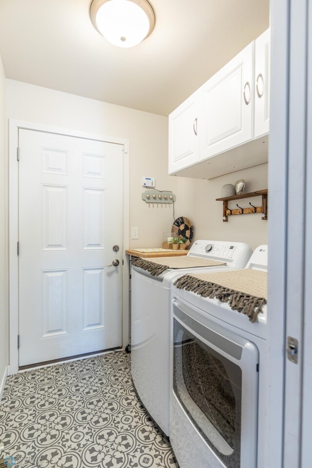 7339 21st St S, Fargo, ND 58104 - laundry area with cabinet space and washer and clothes dryer