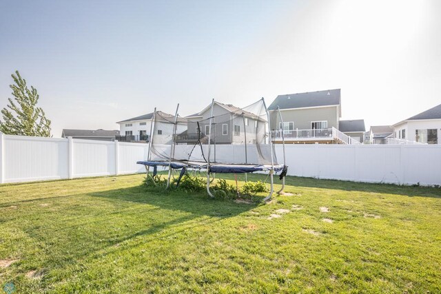 7339 21st St S, Fargo, ND 58104 - fenced backyard with a trampoline