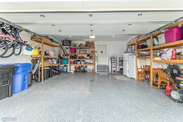 7339 21st St S, Fargo, ND 58104 - garage featuring freestanding refrigerator