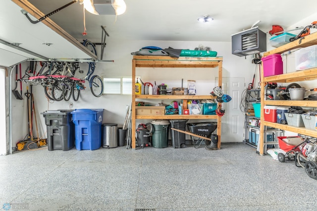 7339 21st St S, Fargo, ND 58104 - garage featuring a heating unit and a garage door opener
