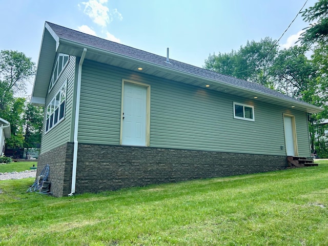 13648 Island Lake Rd W, Lengby, MN 56651 - view of home's exterior featuring a lawn and a shingled roof