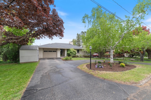 2514 Branch St, Duluth, MN 55812 - single story home with a garage, driveway, a front lawn, and a chimney